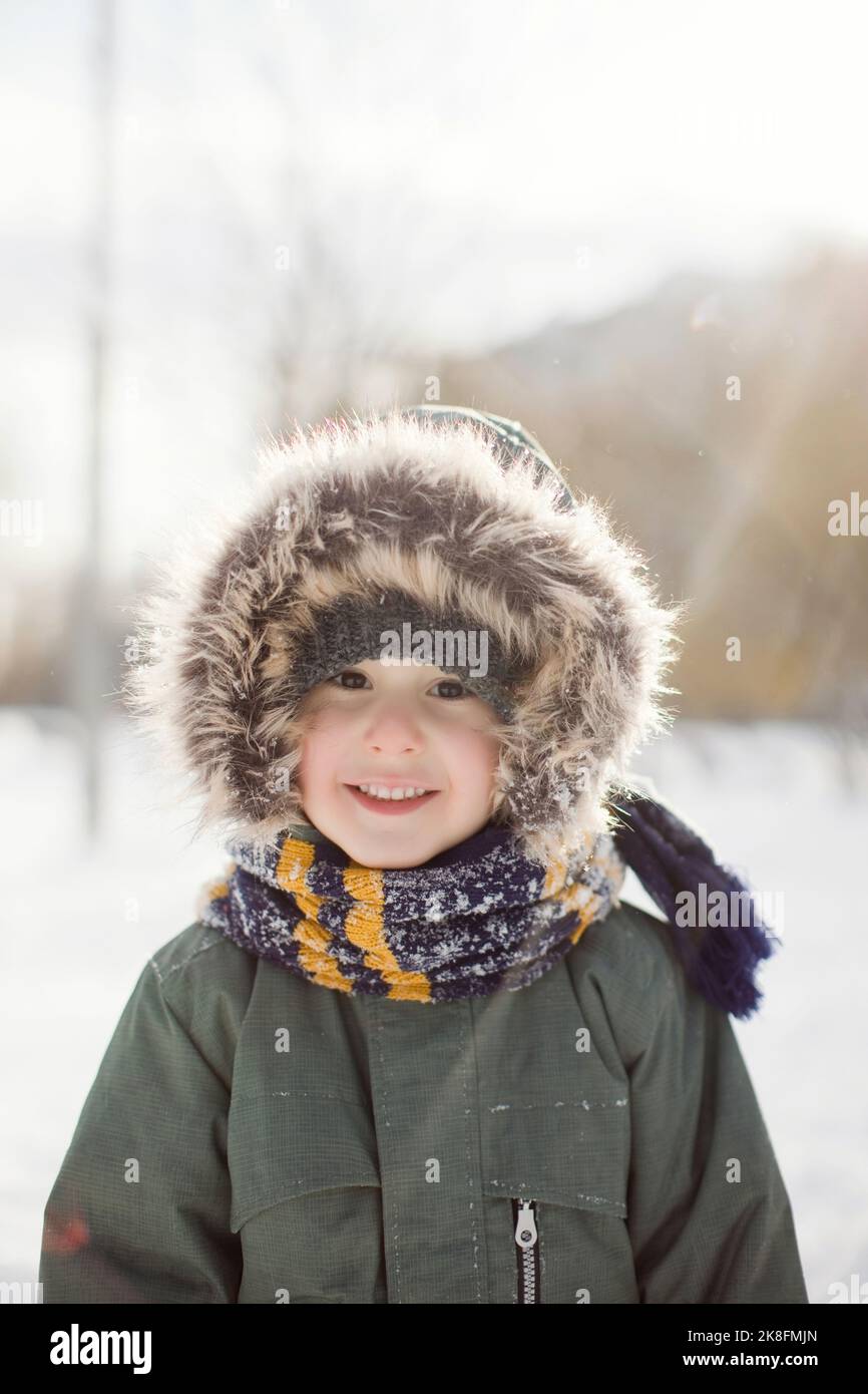 Cute smiling boy wearing warm clothing Stock Photo