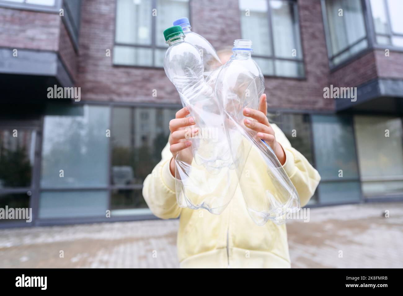 Girl recycling bottles hi-res stock photography and images - Alamy
