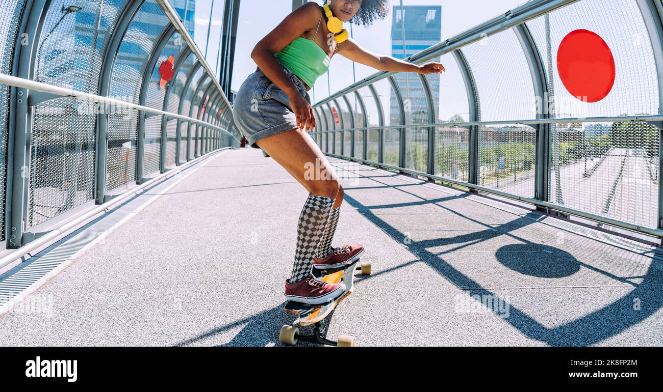 Young woman longboard dancing on bridge Stock Photo Alamy