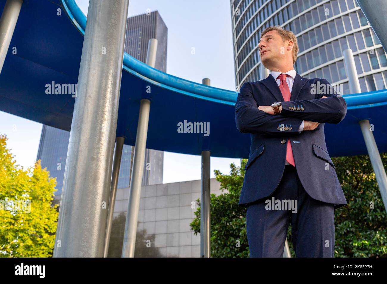 Mature businessman with arms crossed in front of office building Stock ...