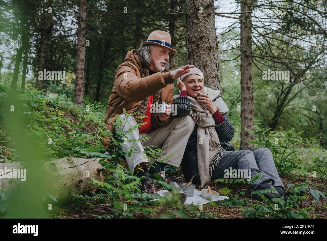 Couple sitting on a tree hi-res stock photography and images - Alamy