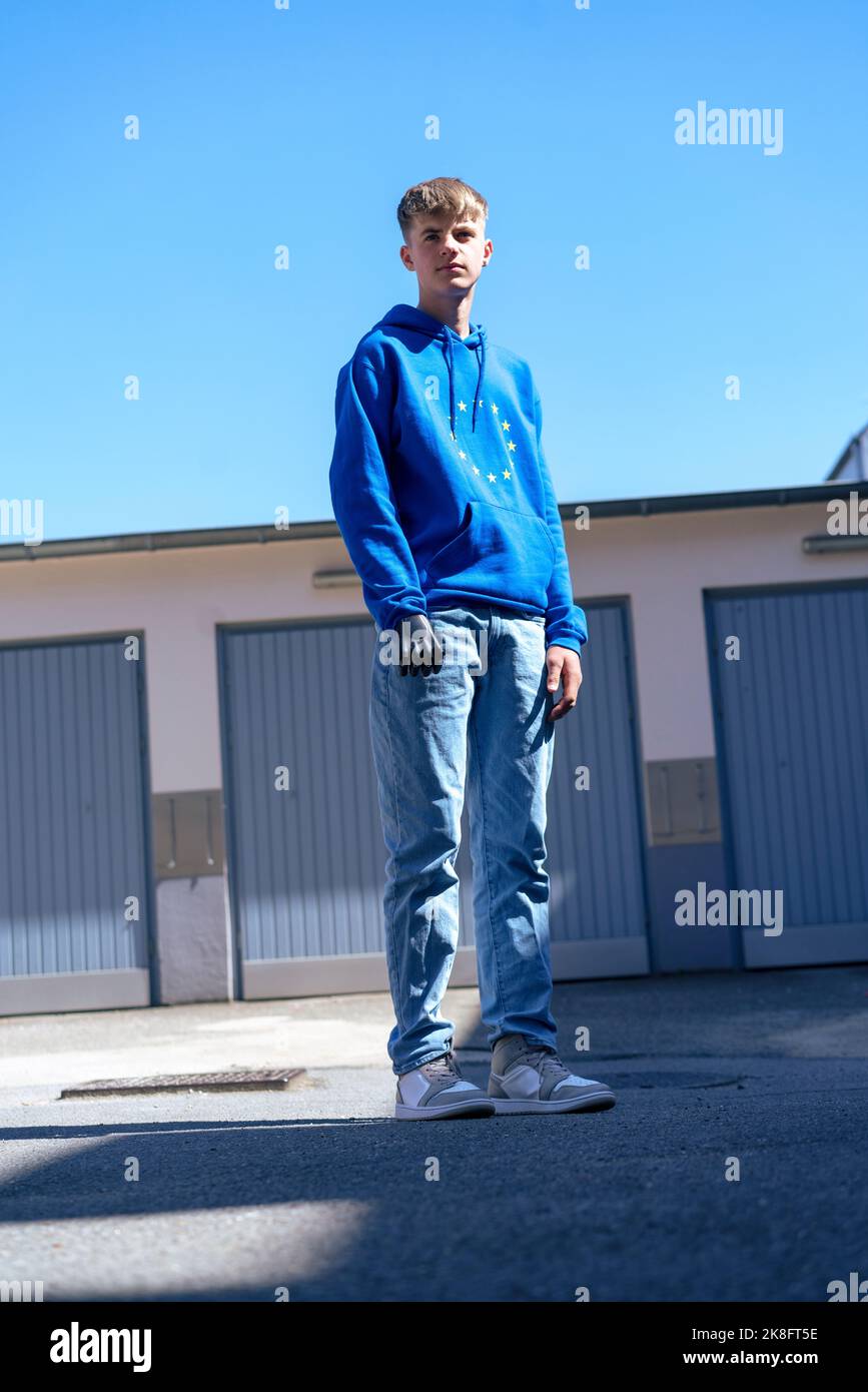 Boy with amputated arm standing on road Stock Photo - Alamy