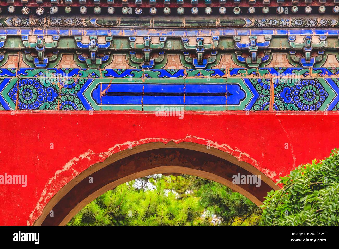 Red Ornate Gate Temple of Sun City Park Beijing China Green Trees Built 1530 in Ming Dynasty Stock Photo