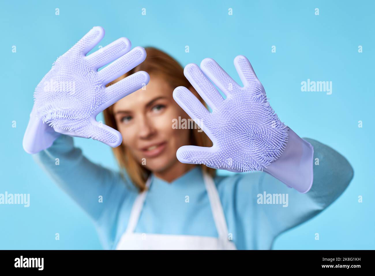 pretty woman in rubber gloves and cleaner apron Stock Photo - Alamy