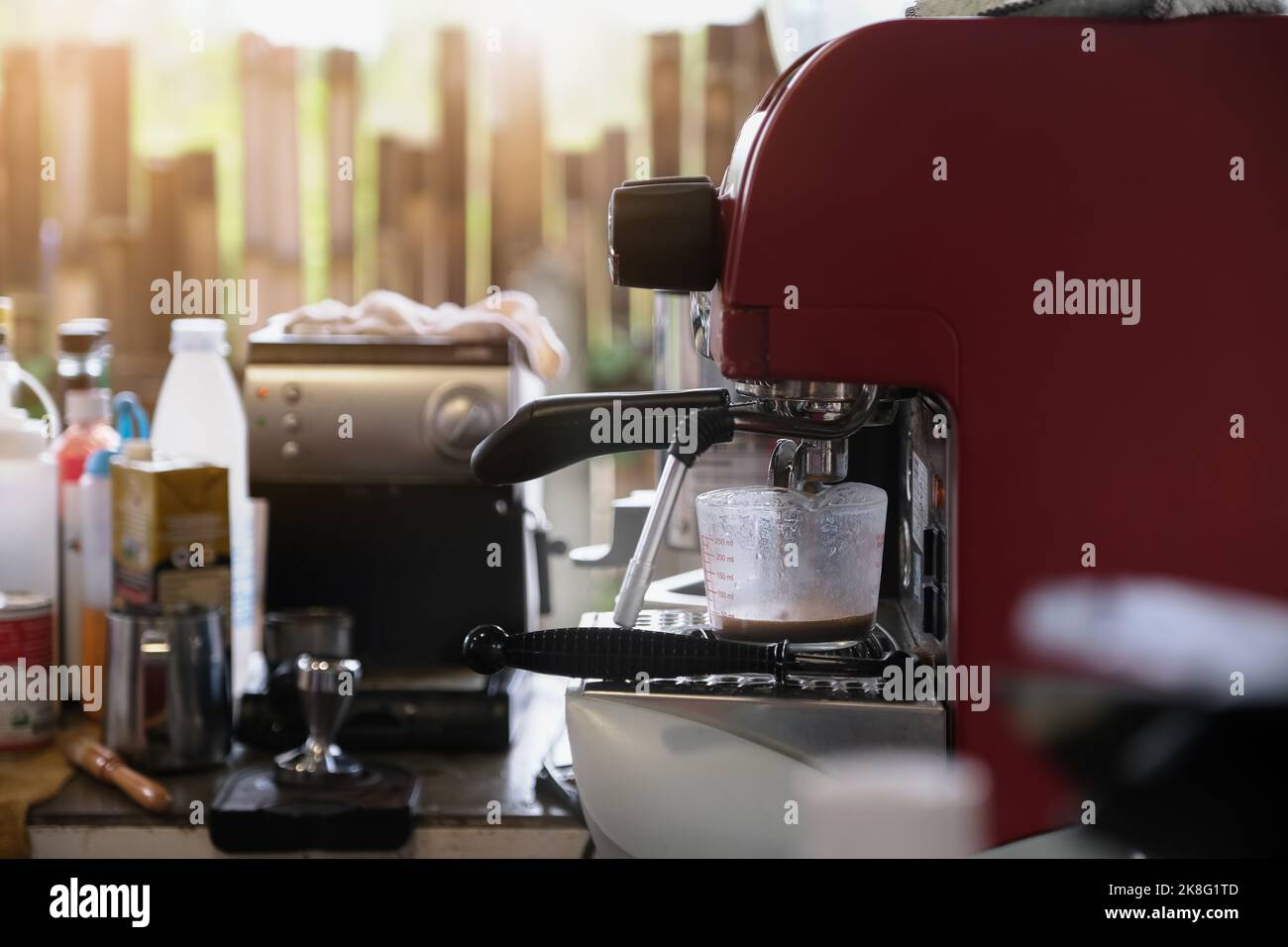 espresso pouring from coffee machine. Professional coffee brewing Stock Photo Alamy
