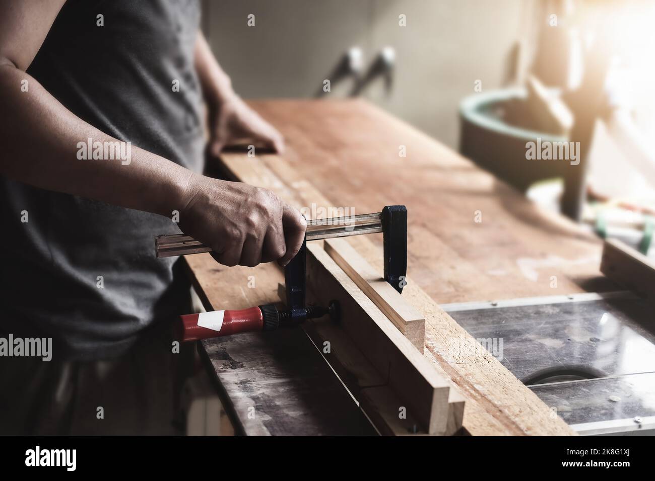 Woodworking operators are decorating pieces of wood to assemble and