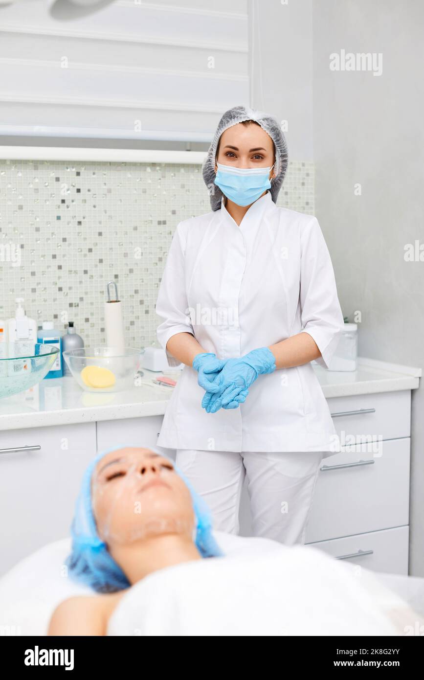 Beautician in blue mask hi-res stock photography and images - Alamy