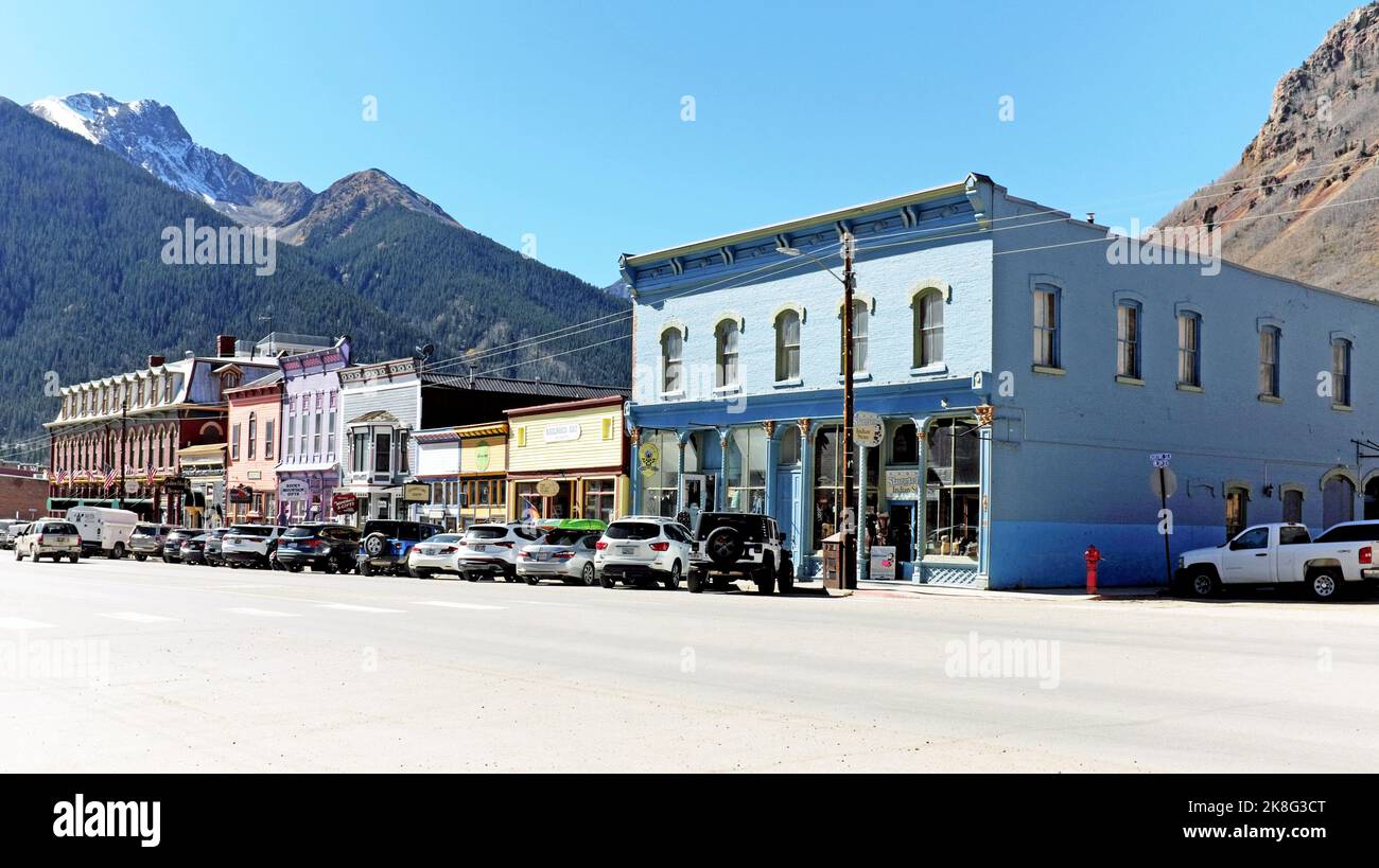 Greene Street, also known as Main Street, in the historic old west mining town of Silverton, Colorado, with a backdrop of the San Juan Mountains. Stock Photo