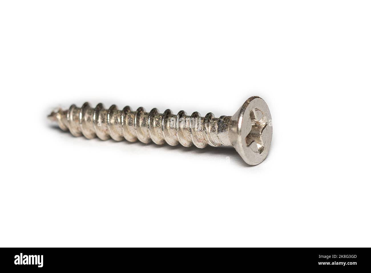 Old rusted screws on a white background Stock Photo