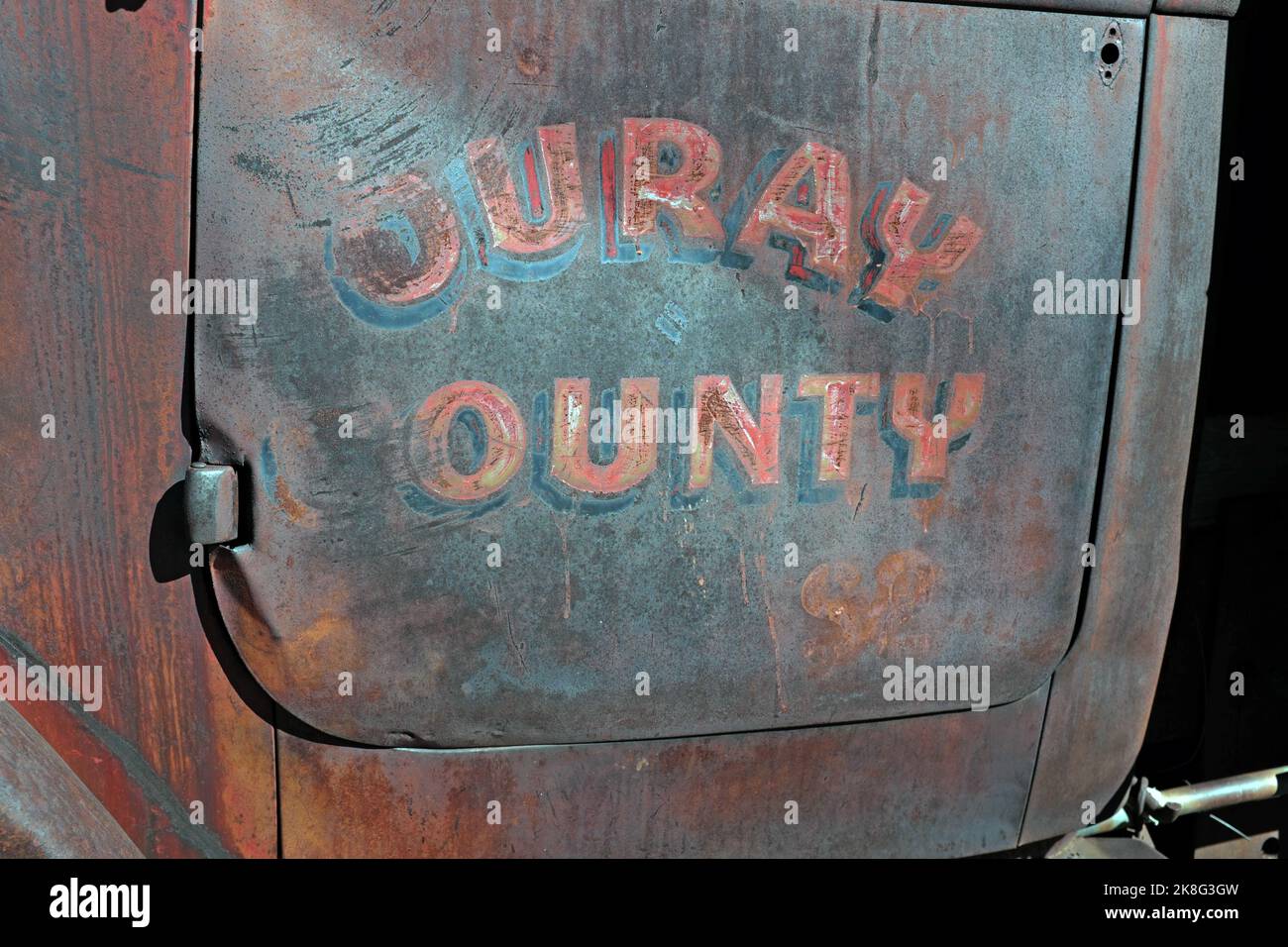 A rusting truck door with Ouray County written on the door in Silverton, Colorado on October 15, 2022. Stock Photo