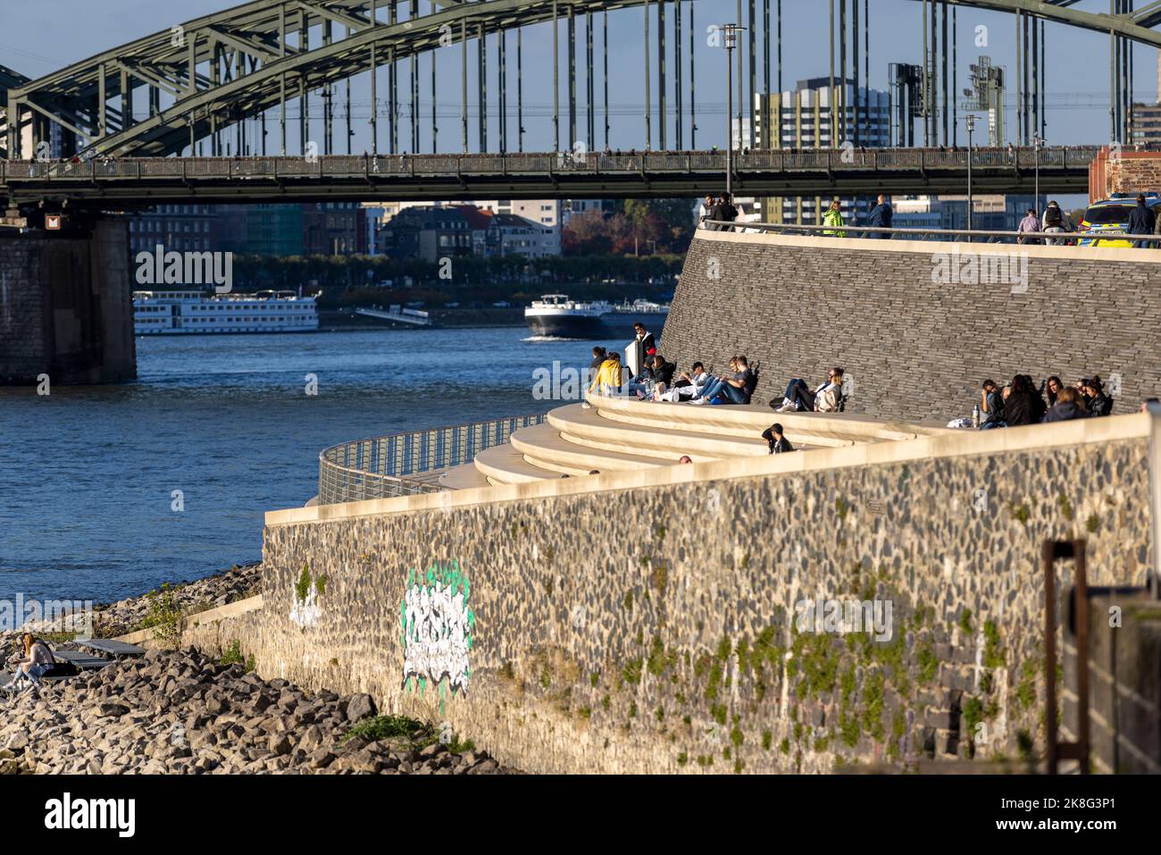 People sitting on stairs on Kennedy Ufer in Cologne Stock Photo