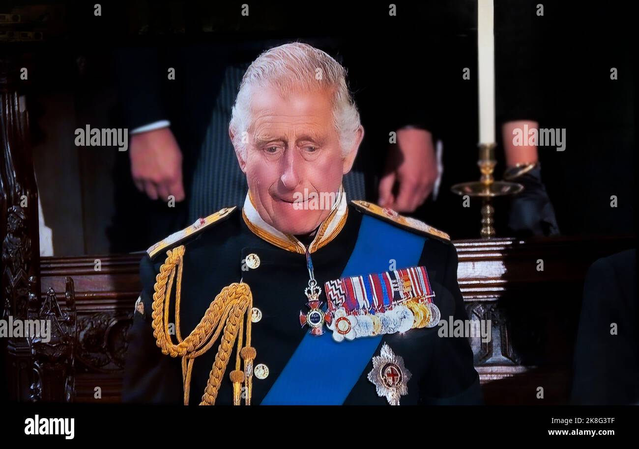 KING CHARLES III Queen Elizabeth Funeral at Saint Georges Chapel Windsor Castle. A pensive sad reflective King Charles III during the interior Royal Chapel funeral service. UHD broadcast still. 19th September 2022 Stock Photo