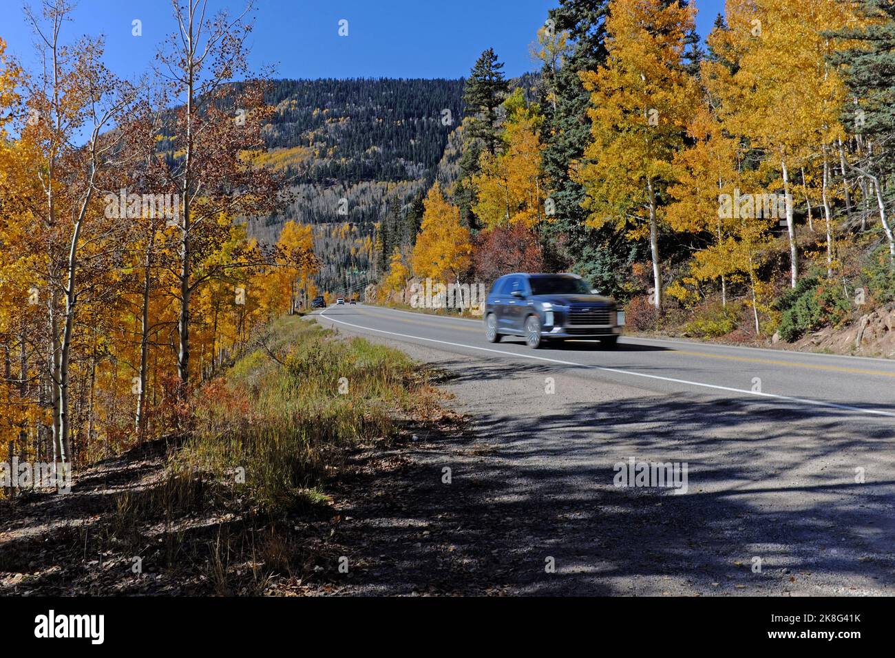 Car drives north on US 550 highway between Durango and Silverton, Colorado in October 2022. Stock Photo