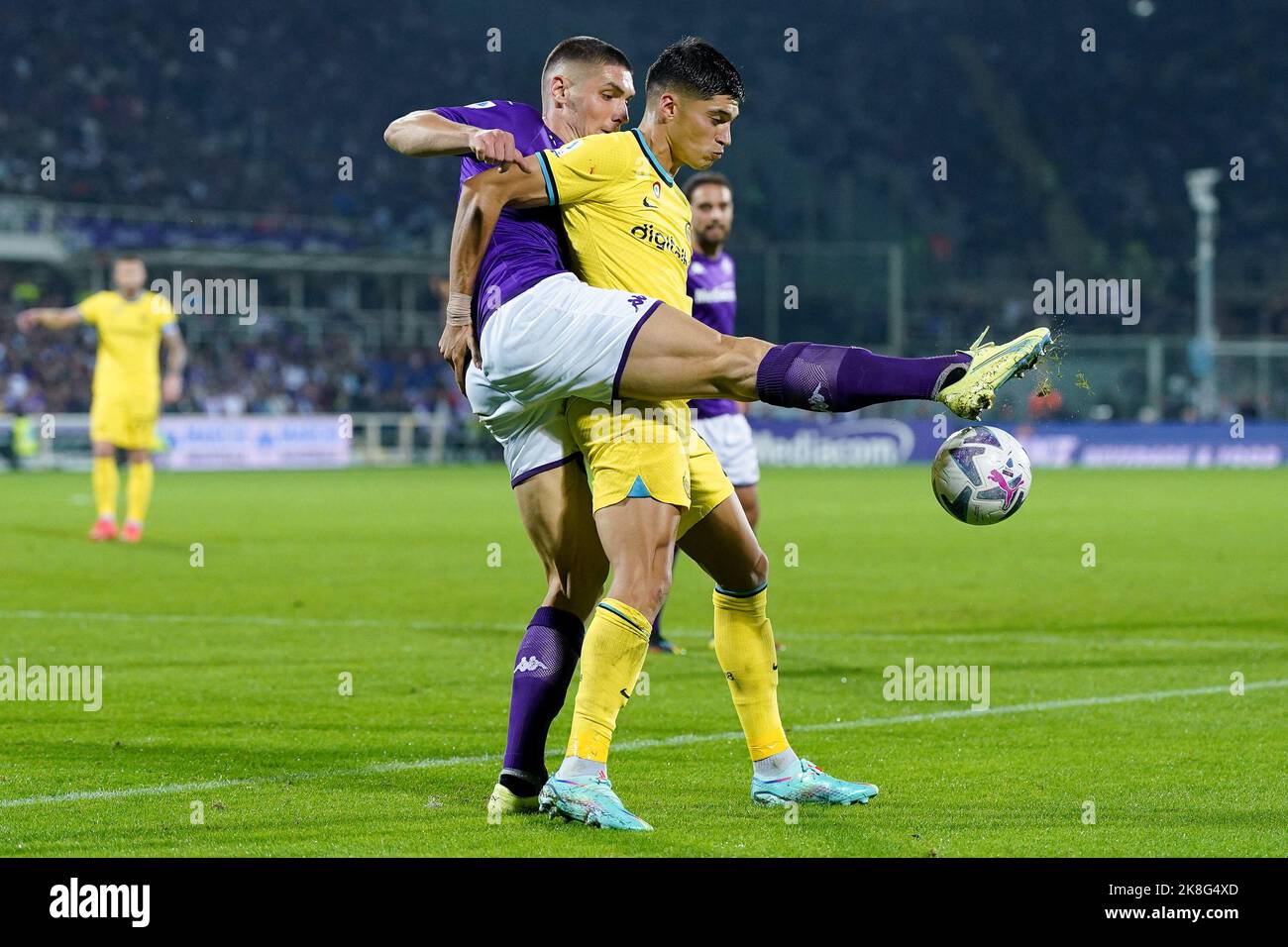 Florence, Italy. 21st May, 2022. Moise Kean of Juventus FC and Nikola  Milenkovic of ACF Fiorentina compete for the ball during the Serie A  2021/2022 football match between ACF Fiorentina and Juventus