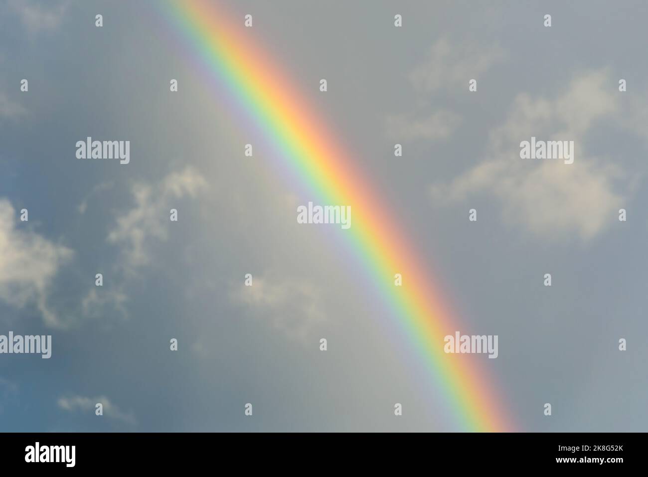 A colorful rainbow on the sky after thunderstorm Stock Photo - Alamy