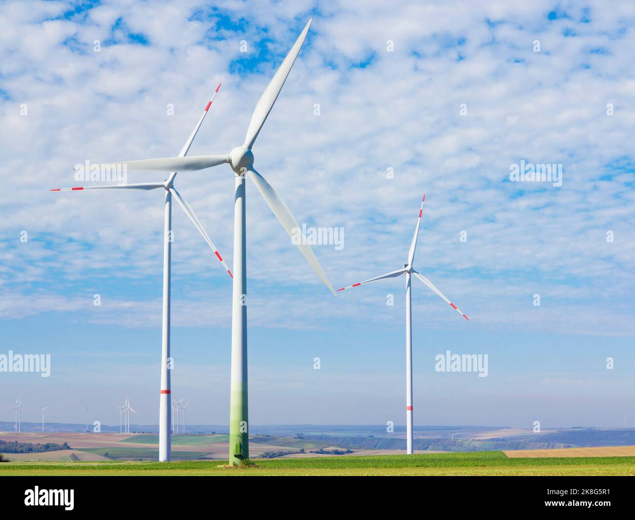 Wind turbines in a rural landscape with blue sky und white clouds Stock ...