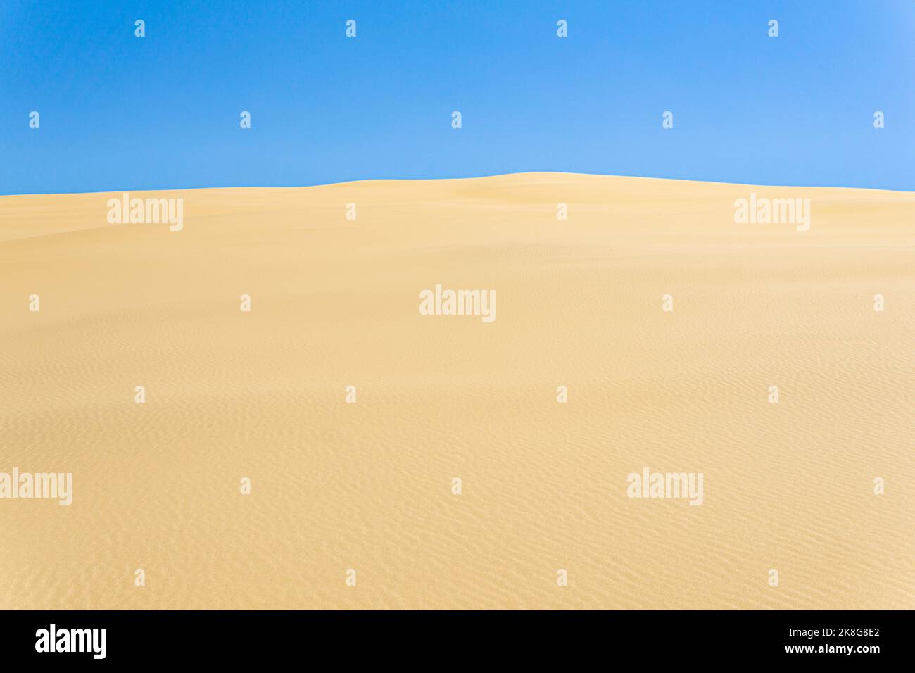 desert landscape, sand dunes under blue sky Stock Photo - Alamy