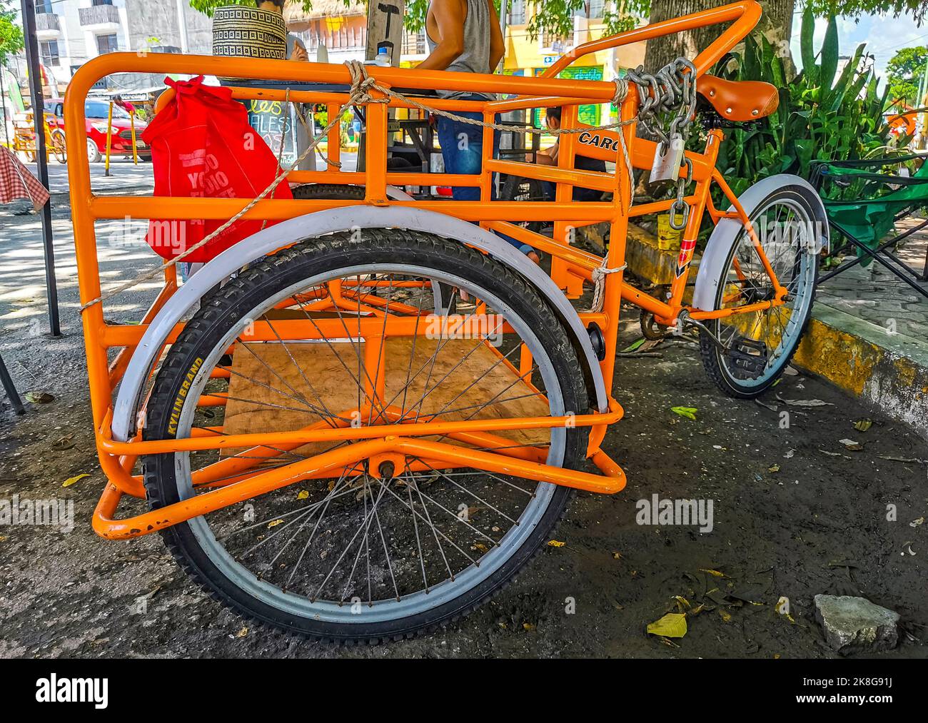 Orange tricycle bike in Playa del Carmen Quintana Roo Mexico Stock