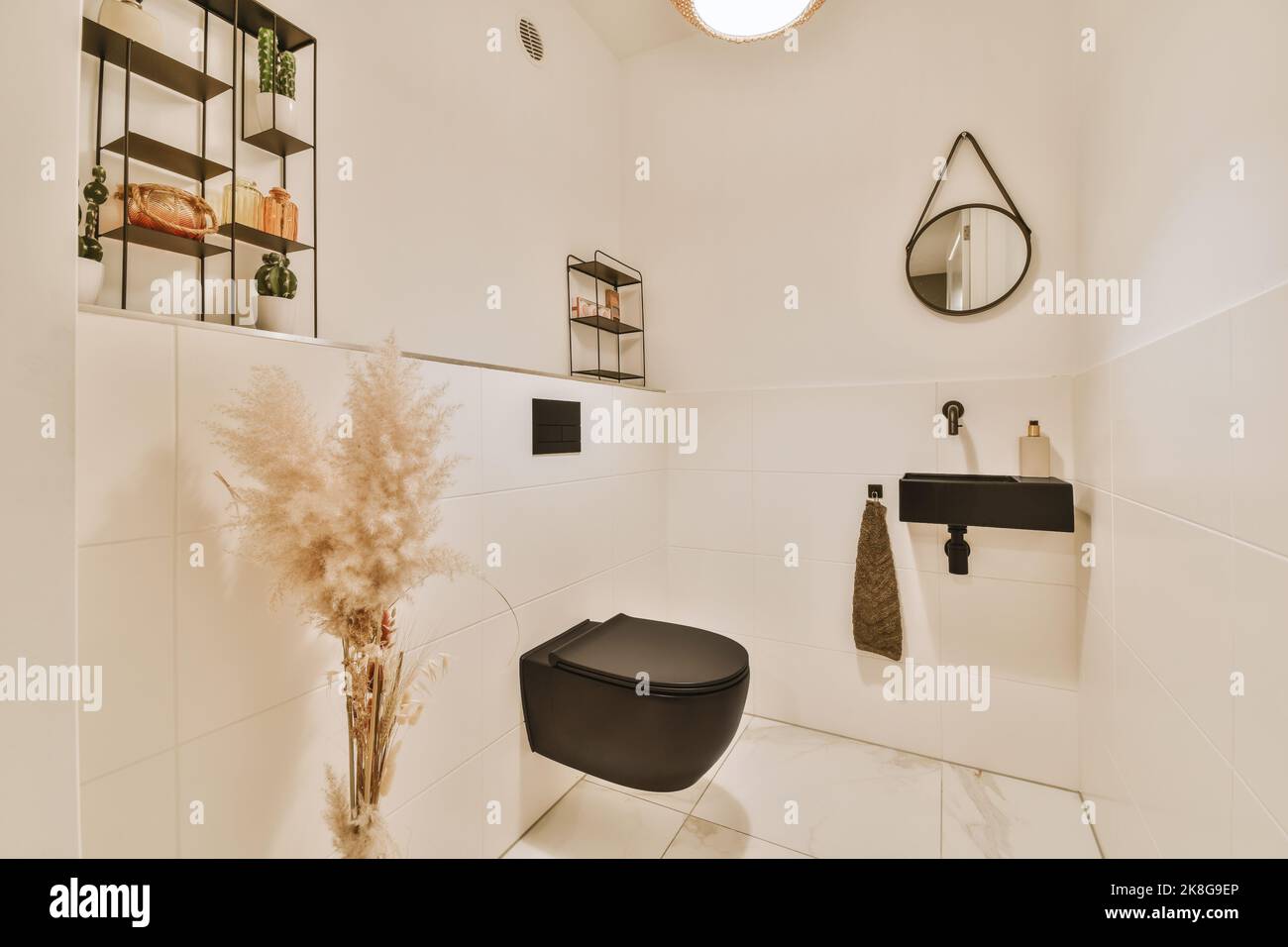 Bathroom with white tiled walls and open shower near sink base
