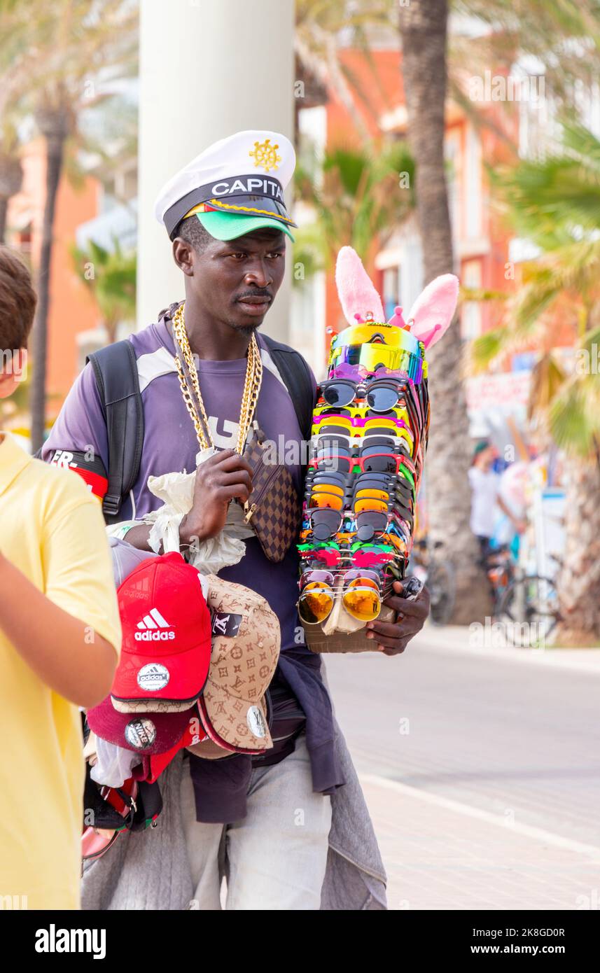 Black man selling sunglasses hotsell