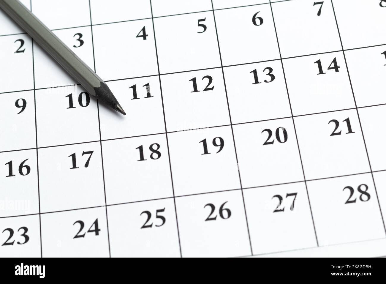 Page with calendar dates and pencil for marking. Planning concept Stock Photo Alamy
