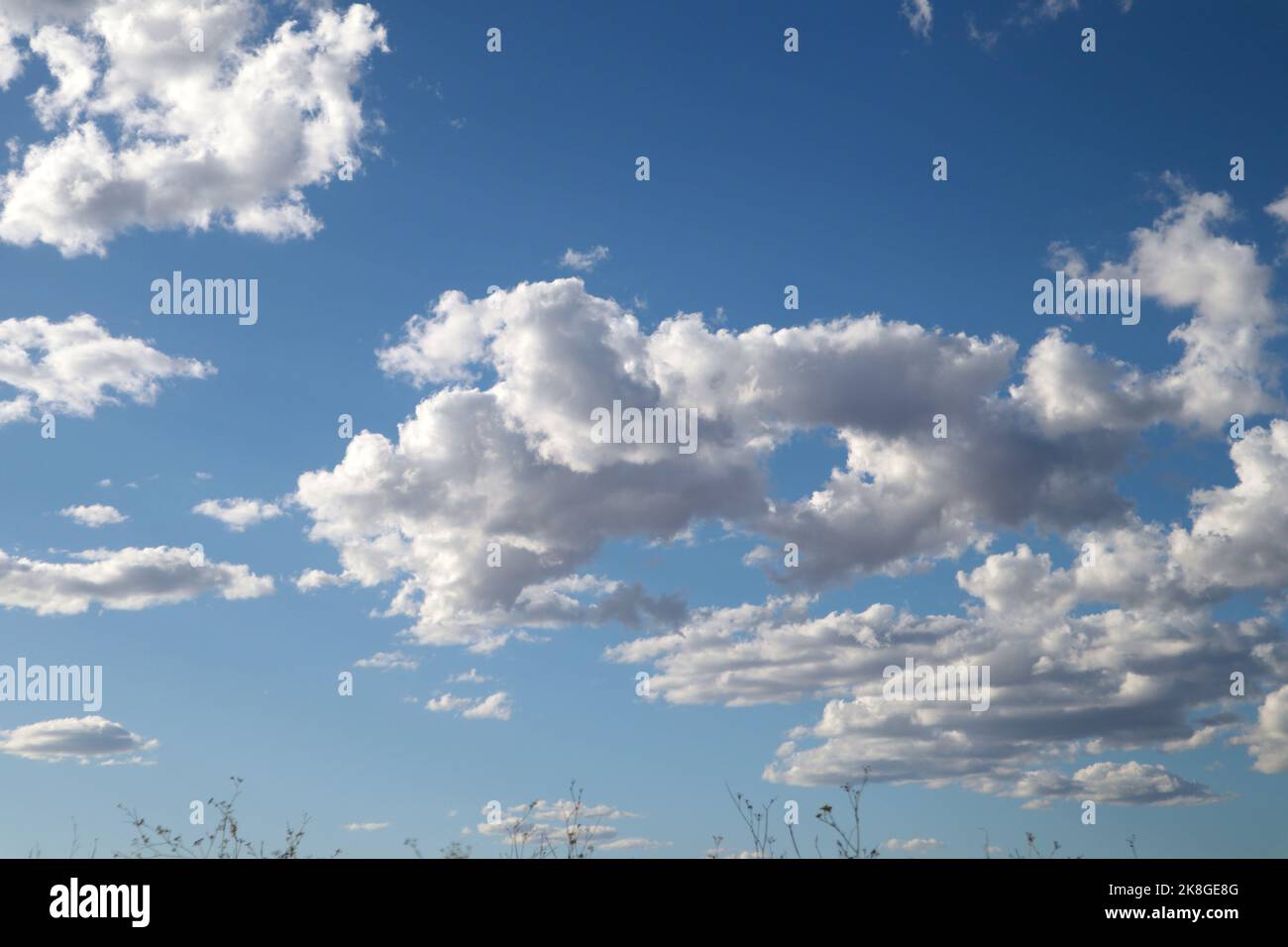 Image of the sky with clouds and clearings that threaten a storm in the blue autumn sky Stock Photo