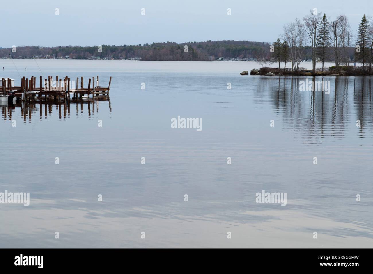 Paugus Bay, is named after Chief Paugus who fought in the Dummer's War. Includes 1,227 acres of waterbody in City of Laconia at Weirs Beach, a family Stock Photo