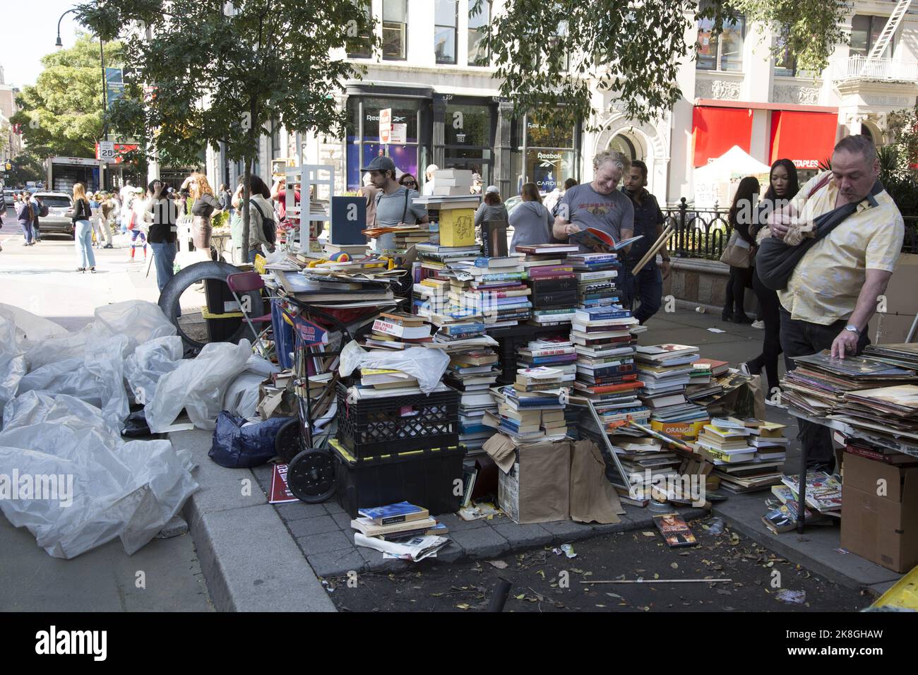 Hardworking independent used book seller along 14th Street at Union Square in Manhattan, New York City. Stock Photo