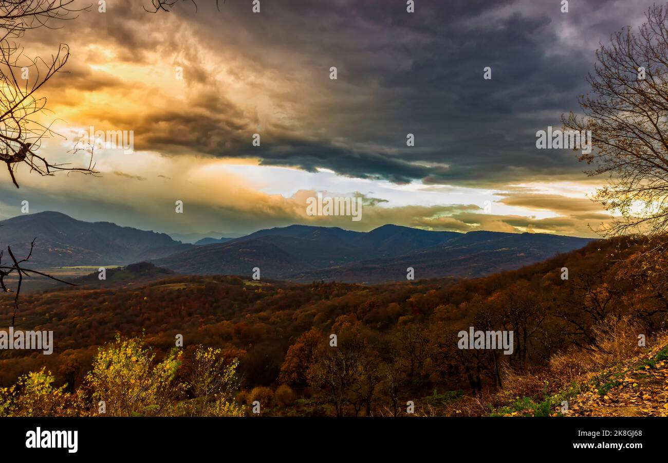 Sunrise in the mountains before the sun appears above the horizon Stock Photo