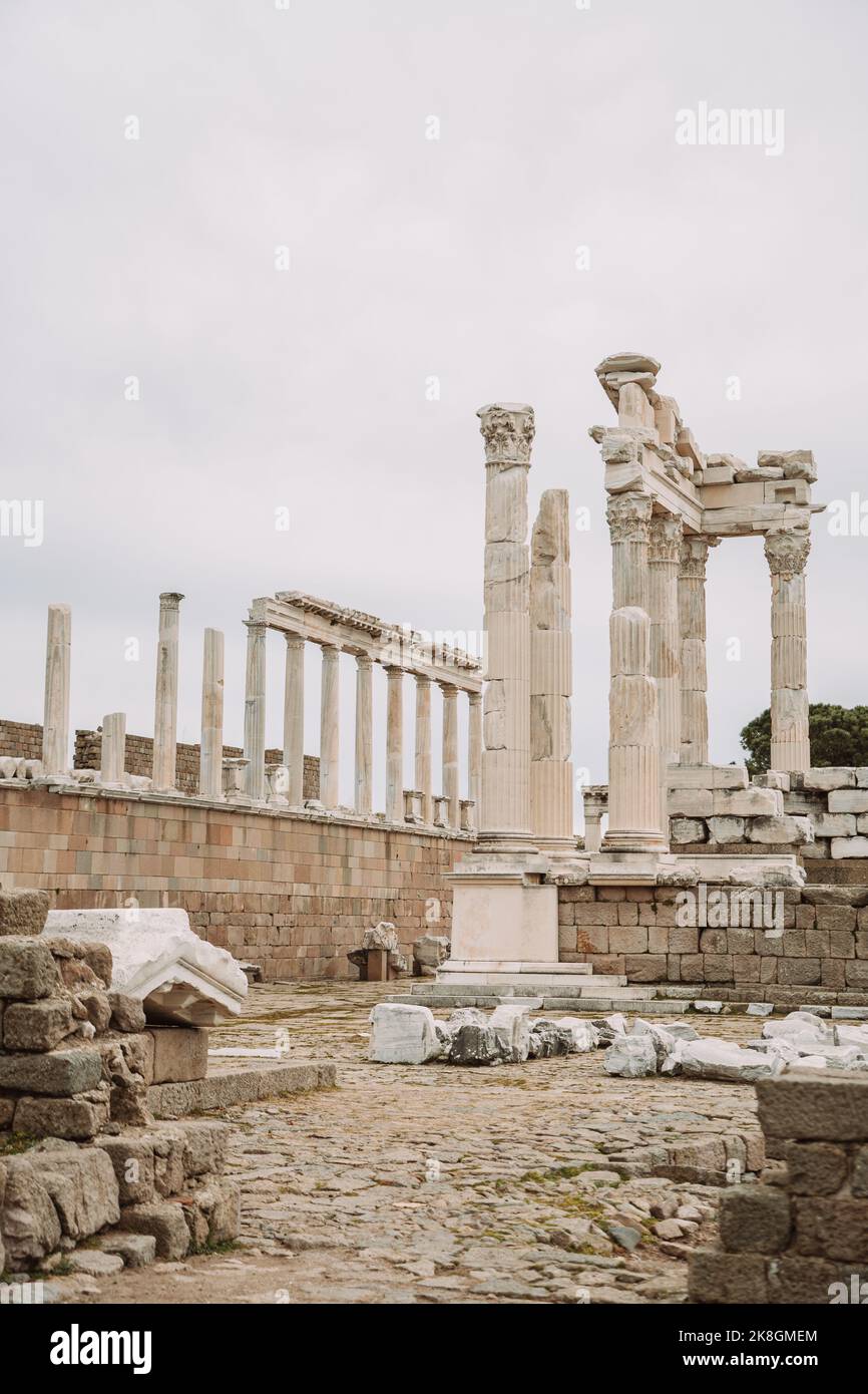 Broken columns of ancient Greek building located against overcast sky