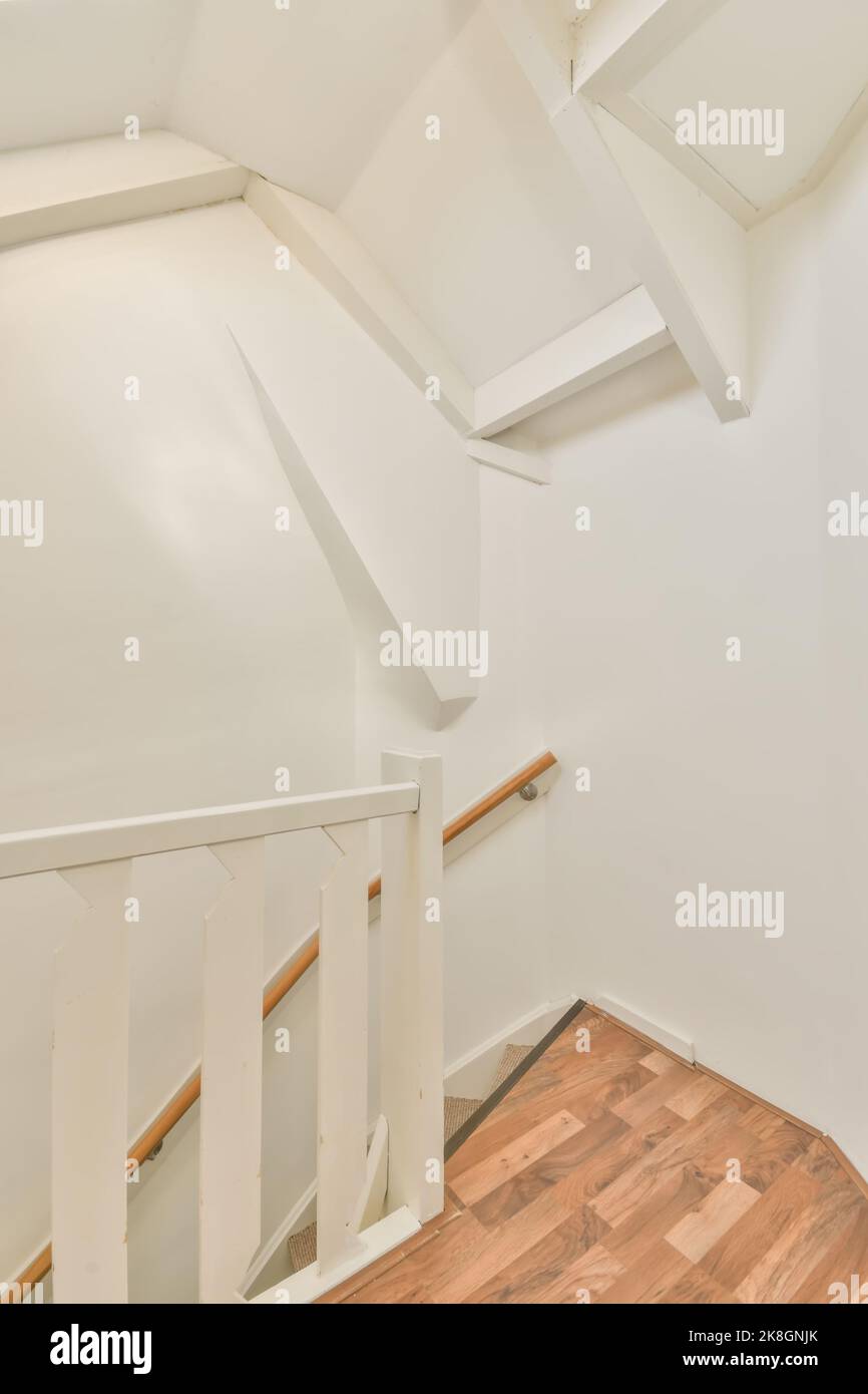 Wooden stairway railing in corridor of classic styled apartment ...