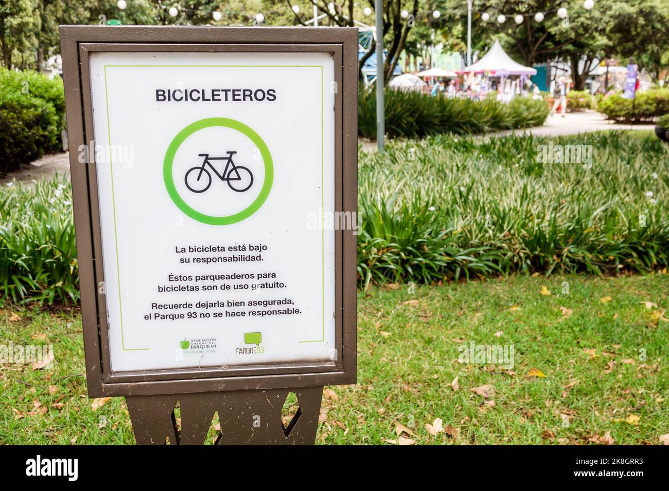Bogota Colombia,El Chico Parque de la 93 Be Happy Fest,sign Spanish language bicycle bike parking rack disclaimer,Colombian Colombians Hispanic Hispan Stock Photo