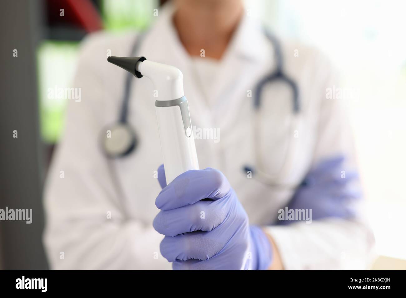 Doctor holding apparatus for laser removal of moles Stock Photo