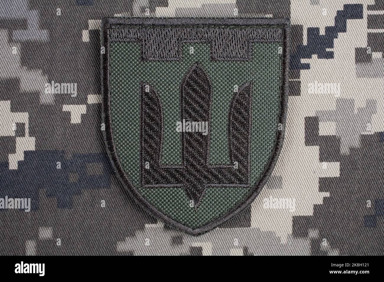 KYIV, UKRAINE - October 6, 2022. Russian invasion in Ukraine 2022. Territorial Defence Forces of Ukraine uniform insignia badge on camouflaged uniform Stock Photo