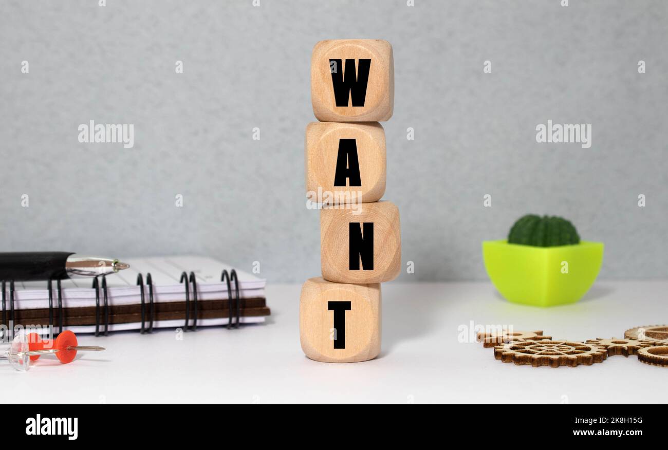 text the word want from gray wooden small letters with black font on an ...