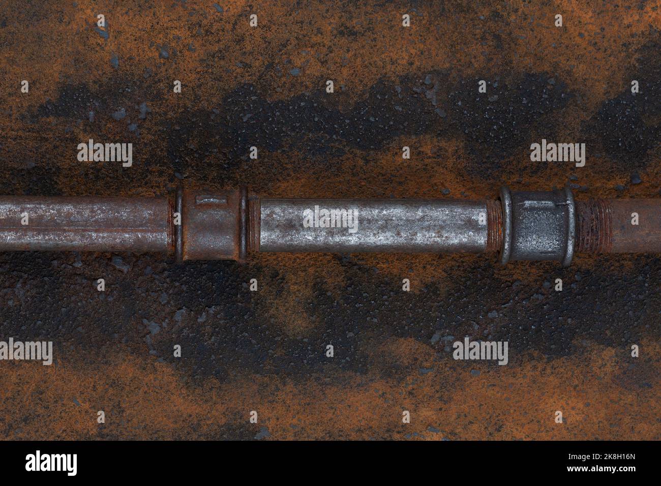 Old rusty valve pipes on rusty metal wall background Stock Photo - Alamy