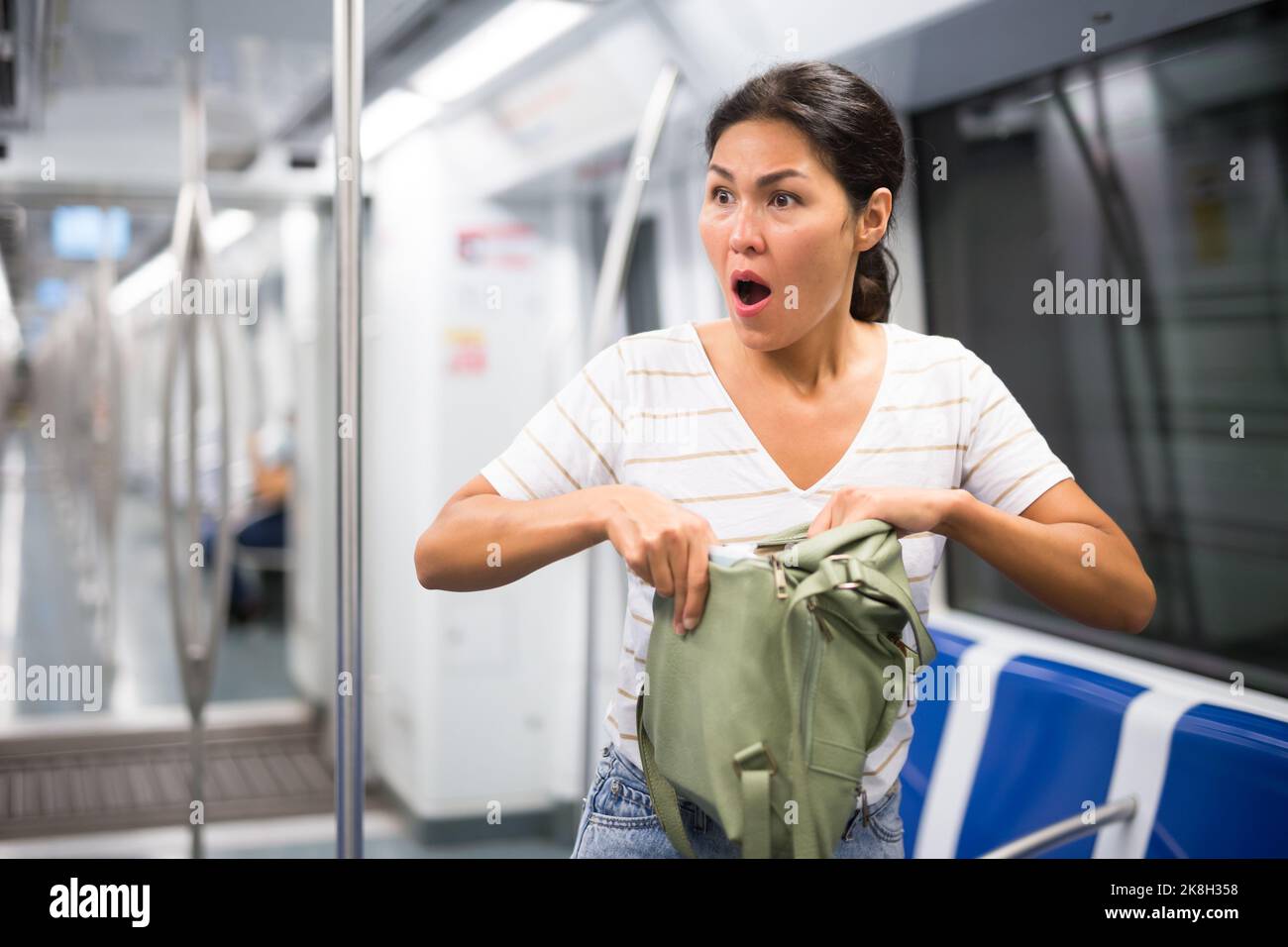 Snatch thief stealing money and handbag from tourist woman, Robber, Thief  concept Stock Photo