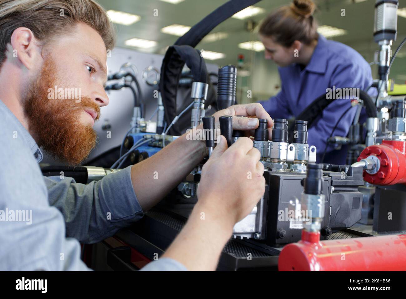 factory engineer operating hydraulic tube bender Stock Photo Alamy