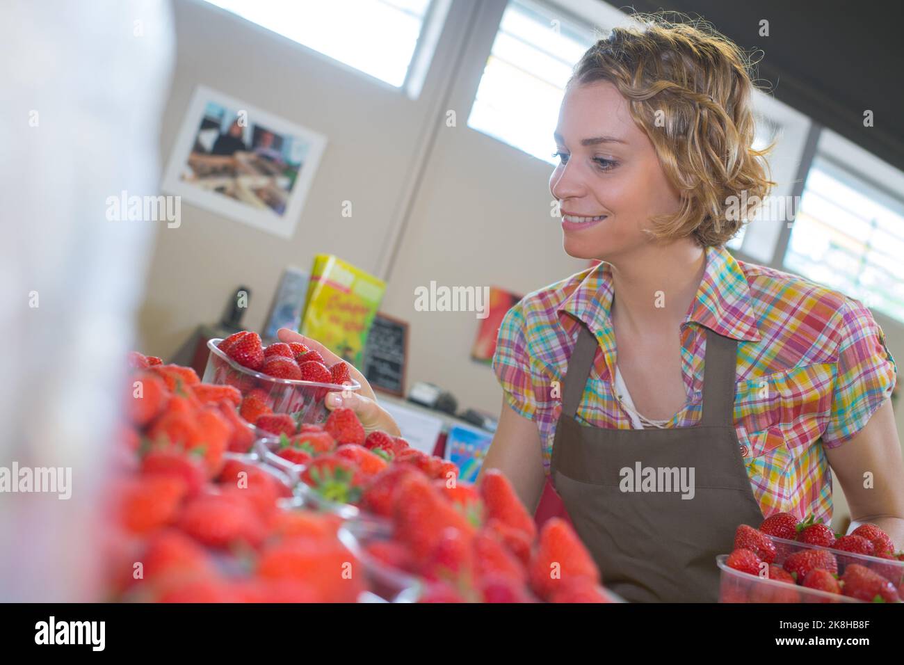 young woma working in the market Stock Photo