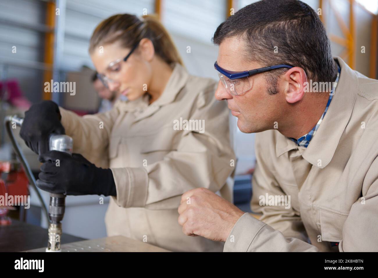 team of workers automotive body parts welder Stock Photo