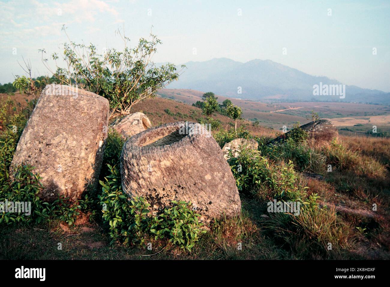 View of ancient stone jars, Plain of Jars, Laos 1997 Stock Photo