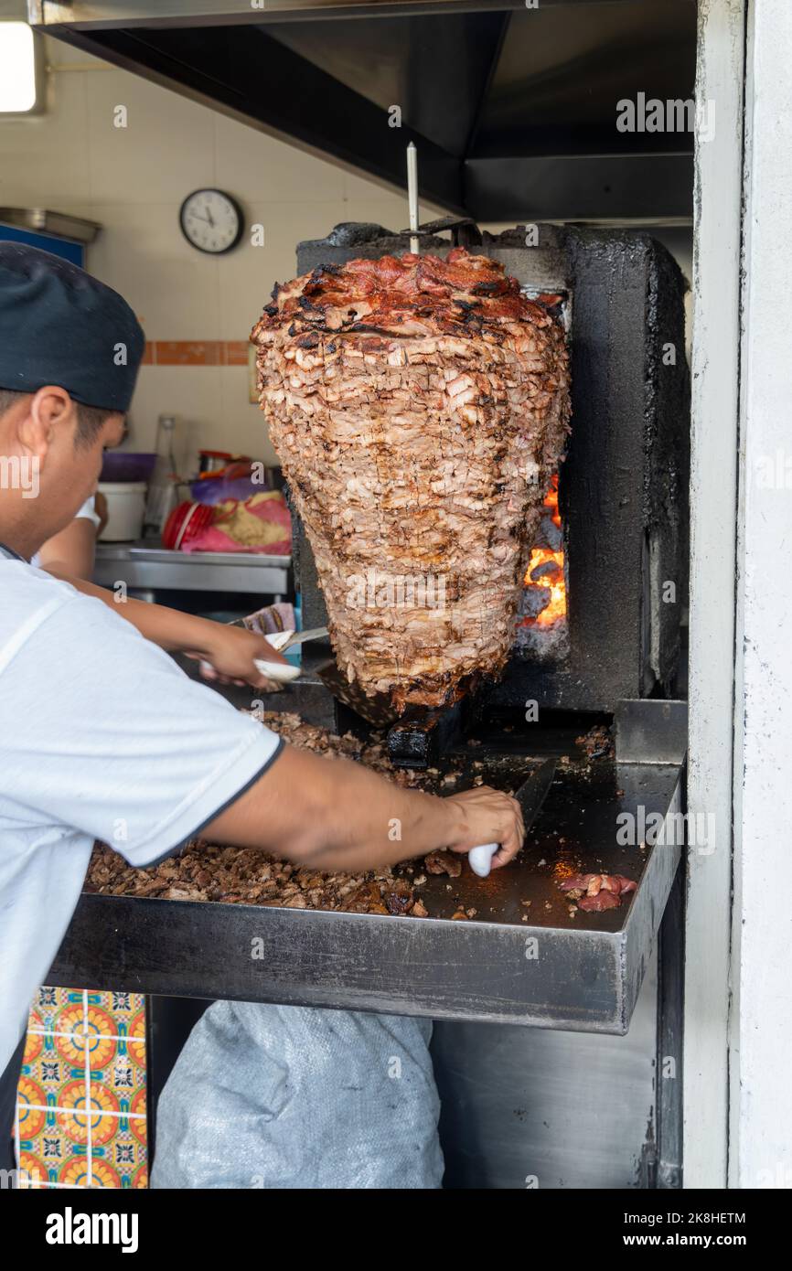 Mexican food Trompo Pastor tacos al pastor, beef stacked in sauce with