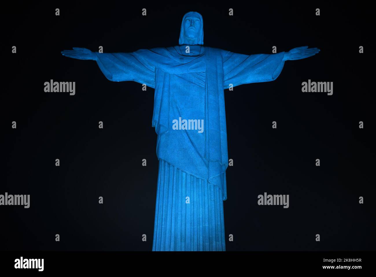 Christ the Redeemer was illuminated in light blue, on the night of this Sunday (16) in celebration of World Food Day, in the south zone of Rio de Jane Stock Photo