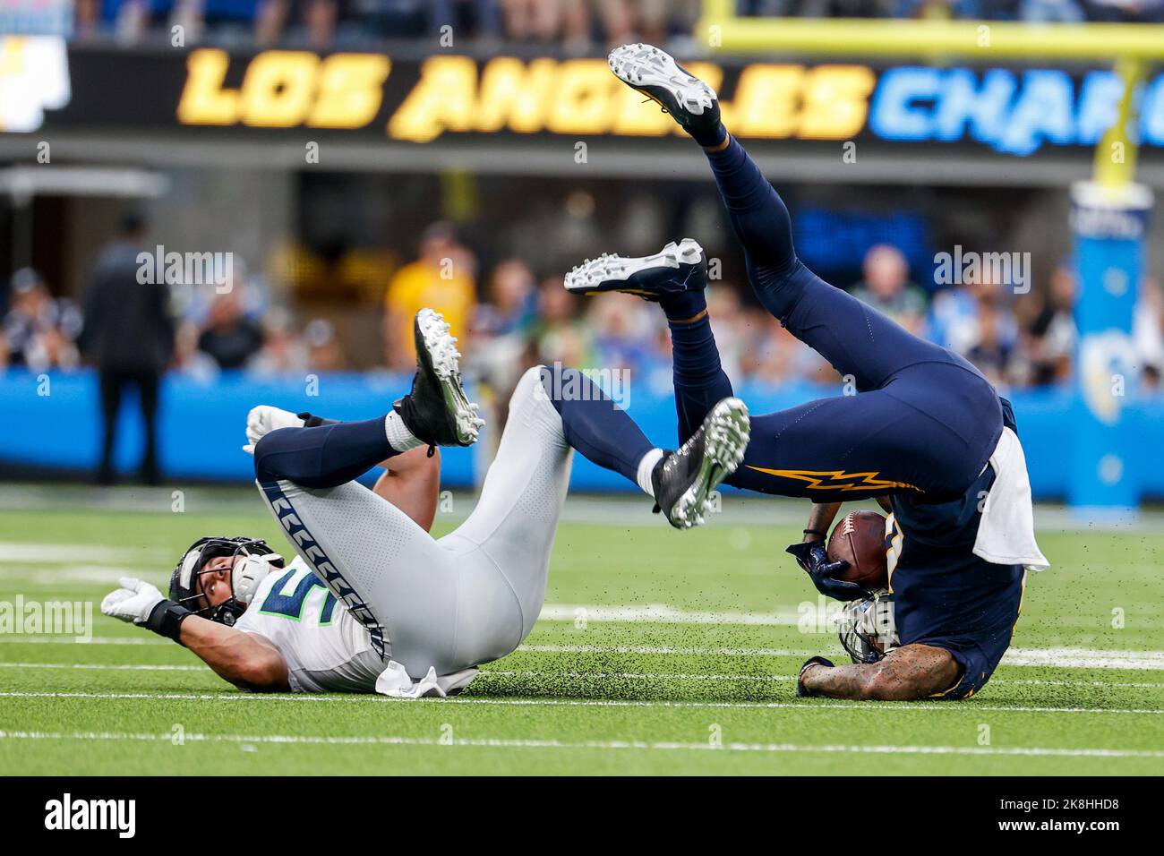 Seattle Seahawks linebacker Jordyn Brooks (56) tosses a signed ball back to  a fan during the NFL football team's training camp, Thursday, Aug. 3, 2023,  in Renton, Wash. (AP Photo/Lindsey Wasson Stock