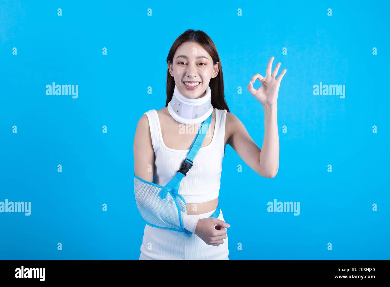 Beautiful young asian woman with broken arm in soft splint suffering a