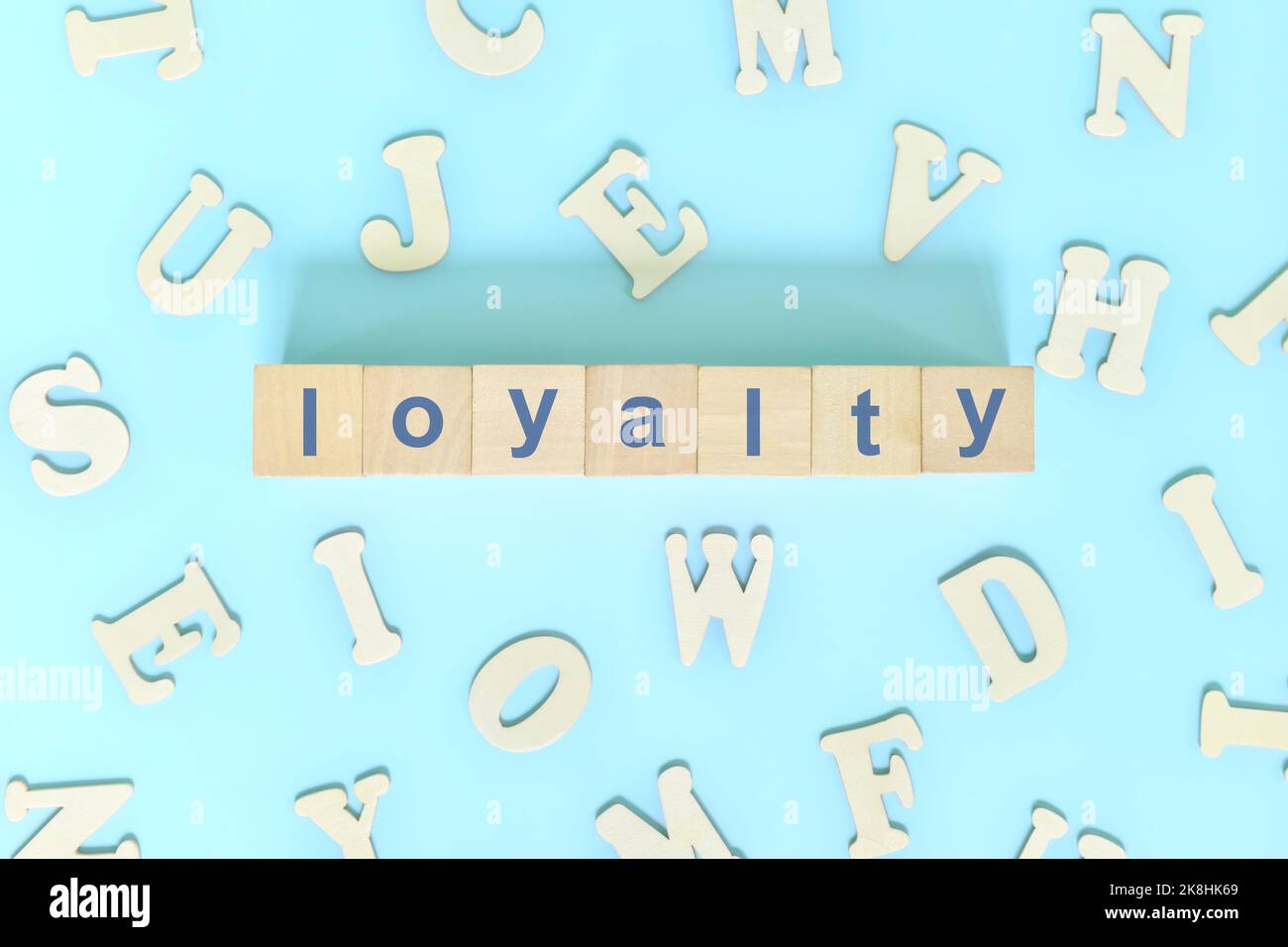 Loyalty core values concept in business, company and organization. Word typography on wooden