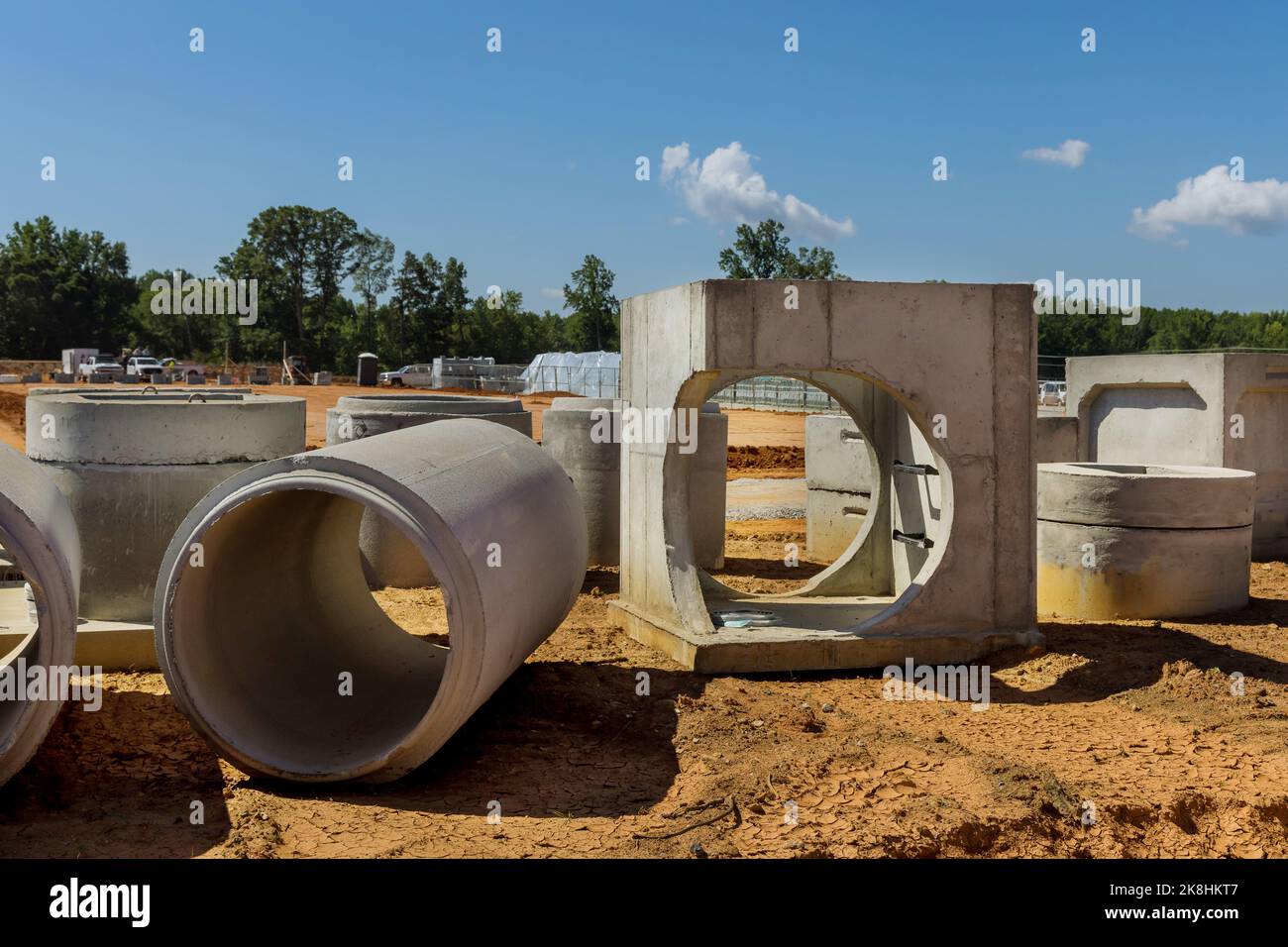 Concrete sewage pipes of large diameters on construction site to