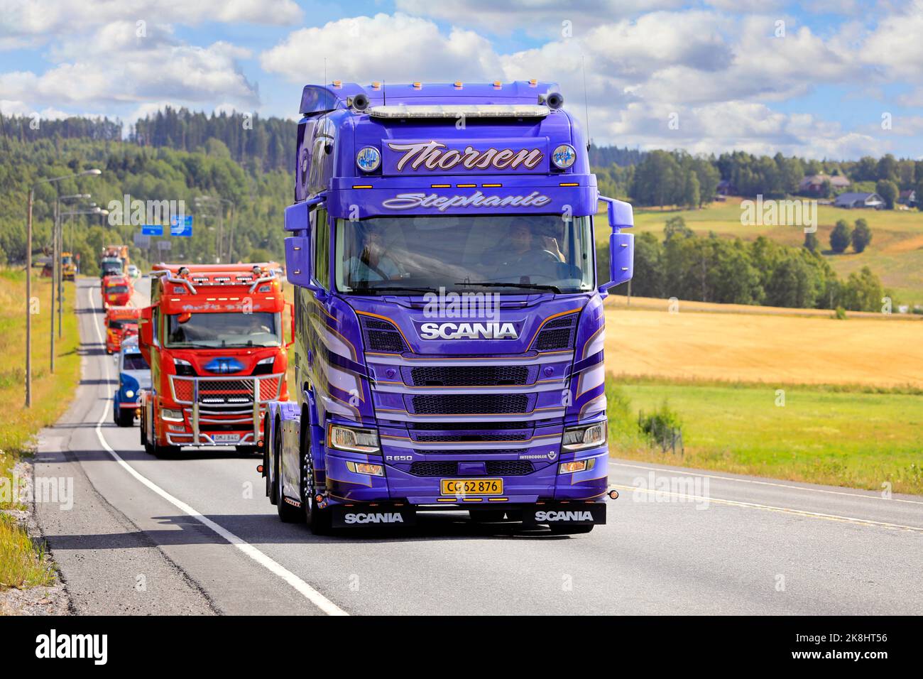 Customised Scania R650 Purple Rain, year 2019, of M Thorsen in truck convoy to Power Truck Show 2022. Road E12, Pirkanmaa, Finland. August 11, 2022. Stock Photo