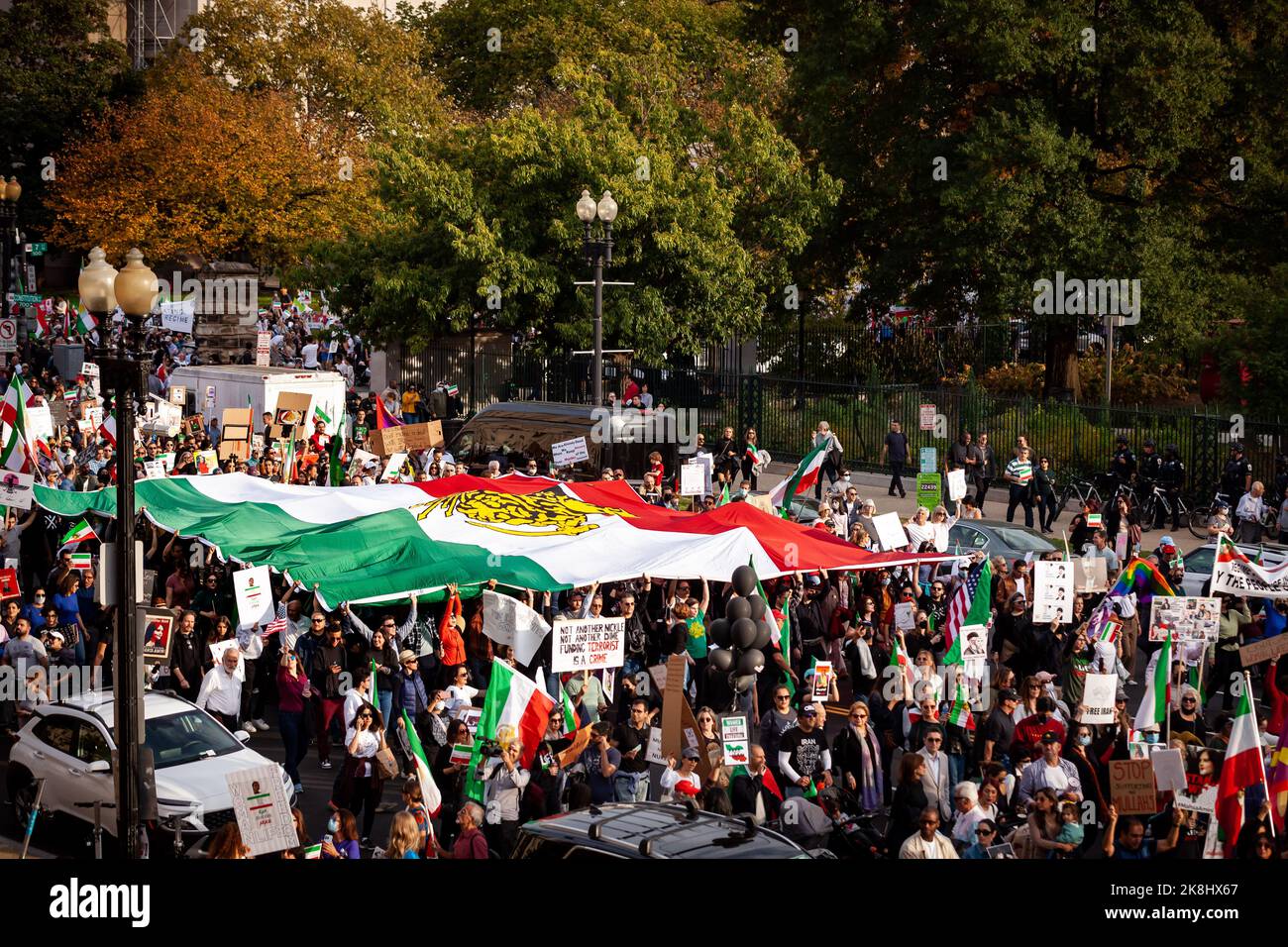 Washington, United States. 22nd Oct, 2022. Demonstrators carry an ...