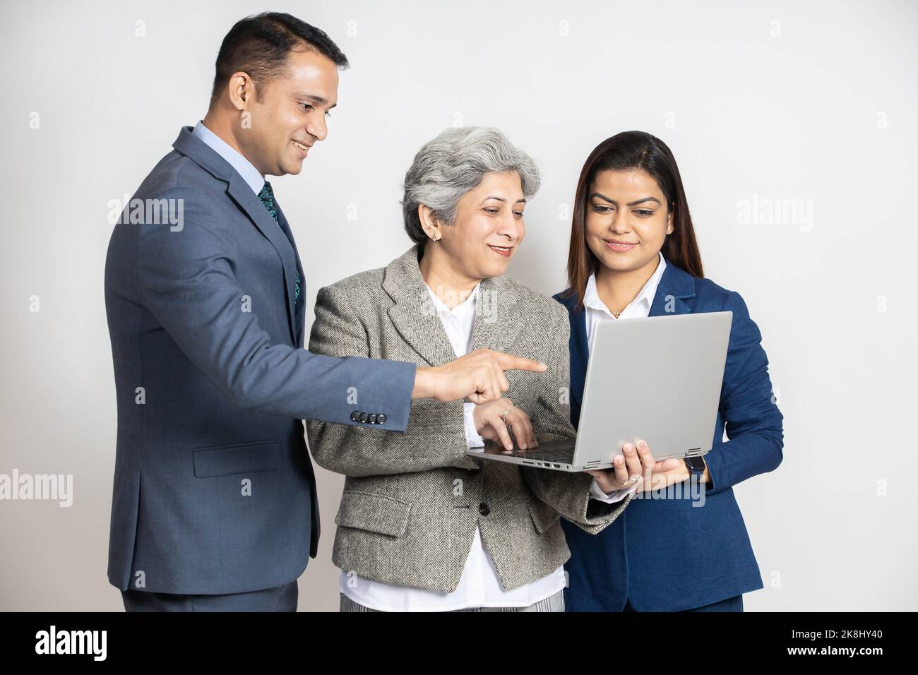 Group of indian business people working together on a laptop at ...